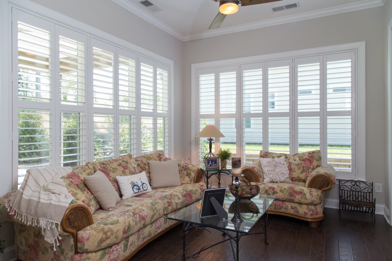 Sunroom with faux wood shutters in Virginia Beach.